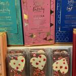 Chocolate and other goods on a shelf.