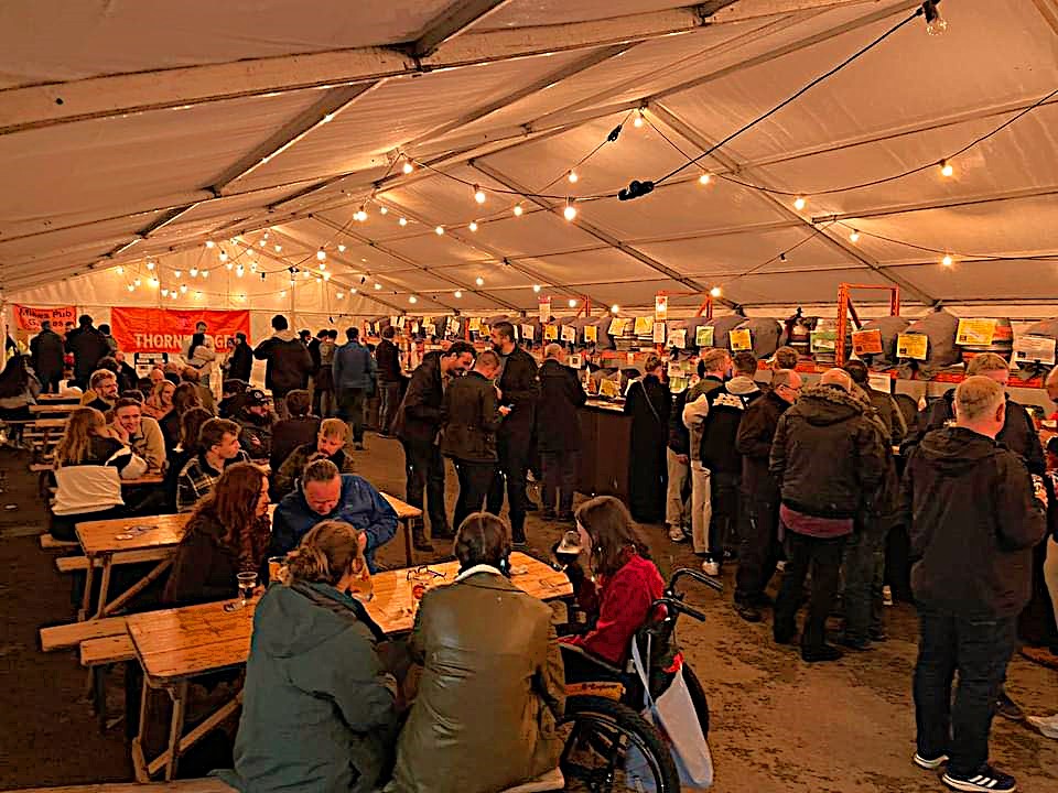 A tent filled with people at the Steel City Beer And Cider Festival.