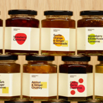 Two rows of jam jars, stacked on top of each other.