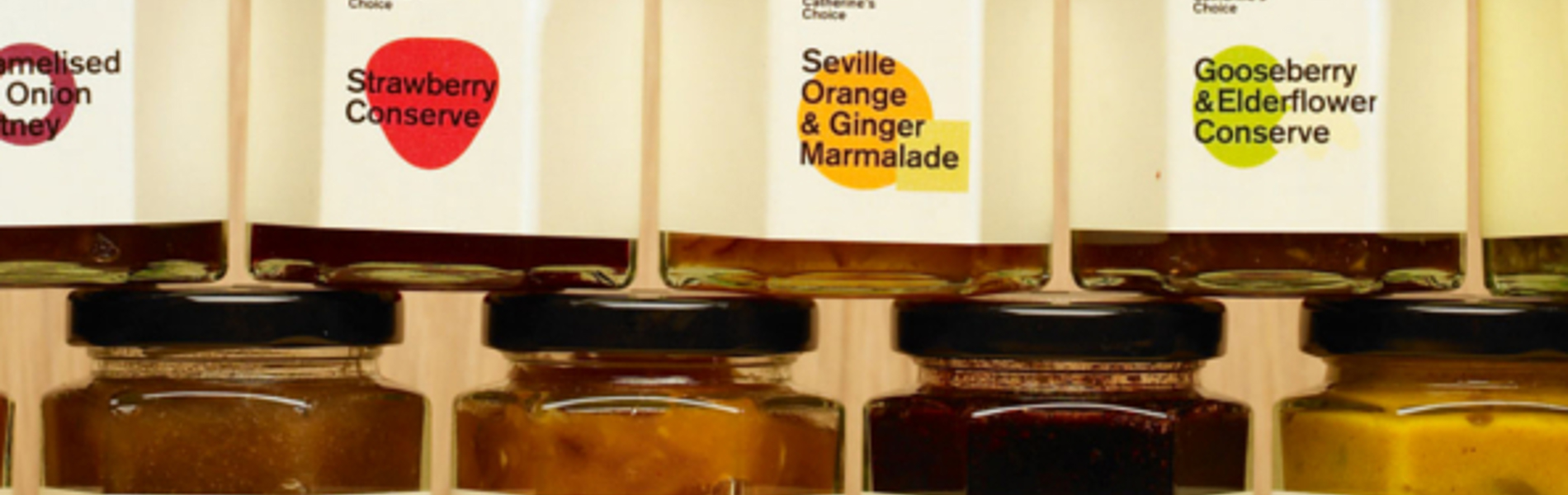 Two rows of jam jars, stacked on top of each other.