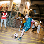Children playing football at Yard Ball, an indoor football park.