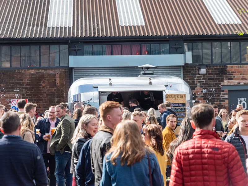 A crowd of people outside at Peddler.