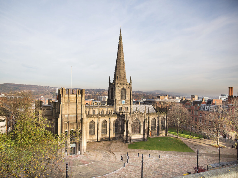 An aerial view of Sheffield Cathedral on a bright sunny day.