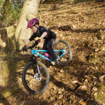People mountain biking in the countryside.