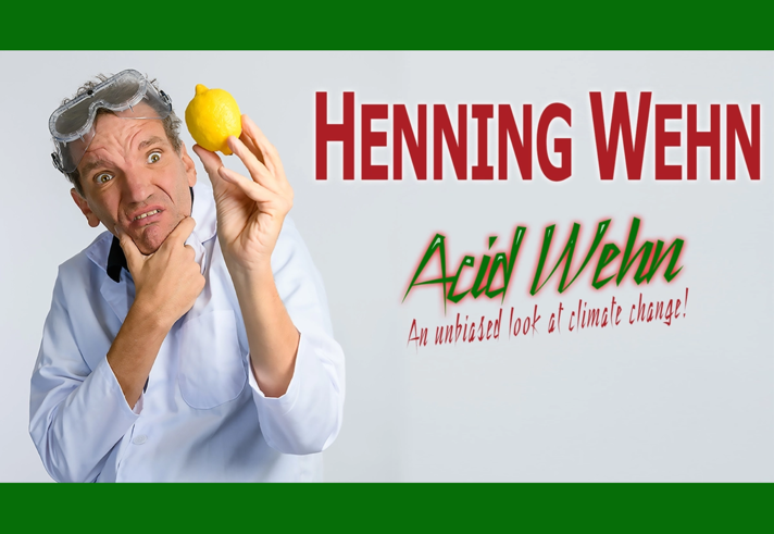 Promo image for the event with Henning Wehn holding up a lemon that he is peering at.