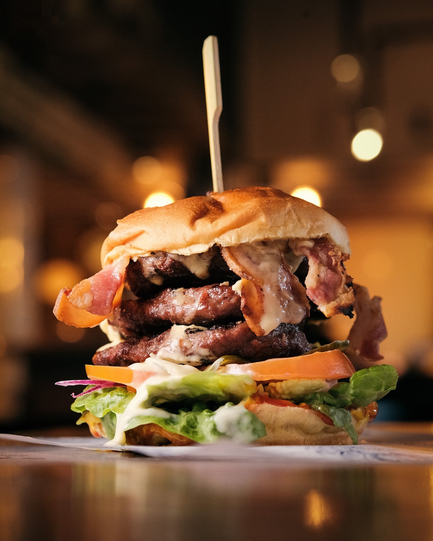 A double patty cheese burger with bacon.