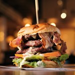 A double patty cheese burger with bacon.