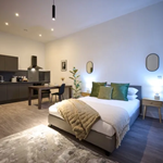 A room with a double bed at JÖRO Oughtibridge Mill.