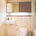 Bathroom at Homely Serviced Apartments – St. Paul’s with sink and mirror.