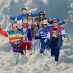 Goldie Lookin Chain, in all their shell-suit glory, superimposed on a glowing cloud.