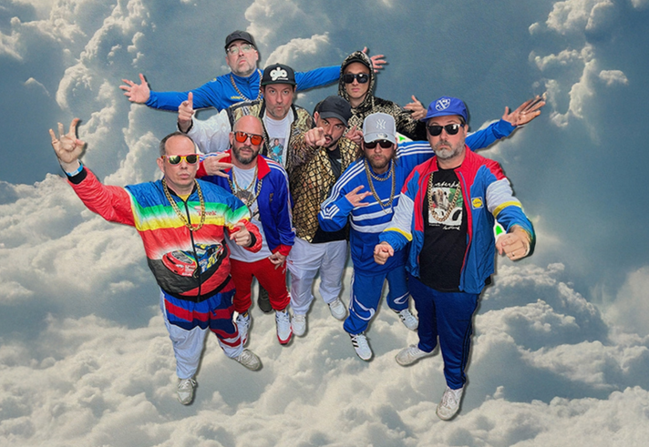 Goldie Lookin Chain, in all their shell-suit glory, superimposed on a glowing cloud.