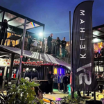 SYSheffield lit up in the evening, full of people having a night out.