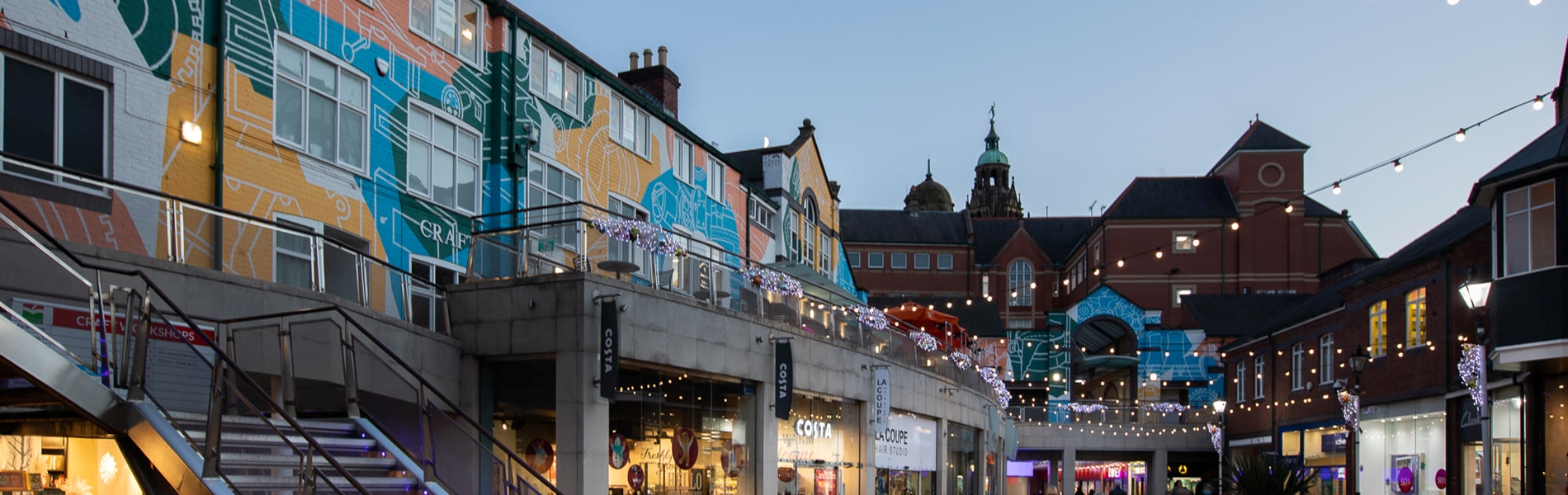 Inside Orchard Square at dusk.