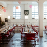Rows of tables set up for an event at The Hide.