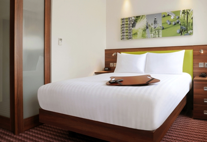 Modern double bed setup in a guest room at Hampton by Hilton Sheffield.