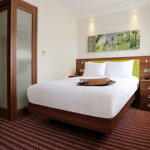Modern double bed setup in a guest room at Hampton by Hilton Sheffield.