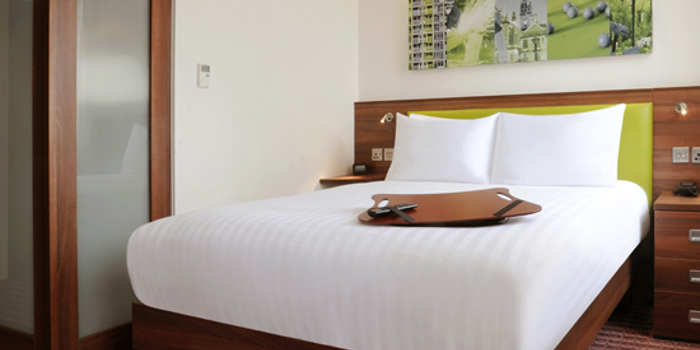 Modern double bed setup in a guest room at Hampton by Hilton Sheffield.