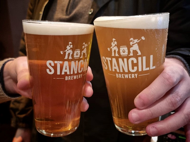 A close up of two pints of beer in Stancill Brewery glasses.