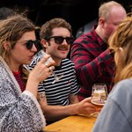 People enjoying a beer outdoors at The Brewery of St Mars of the Desert.