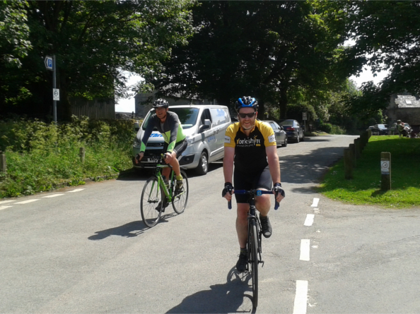 Two people road cycling.