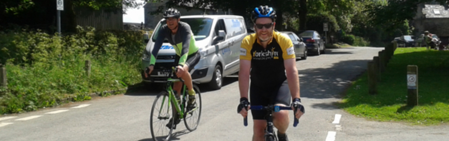 Two people road cycling.
