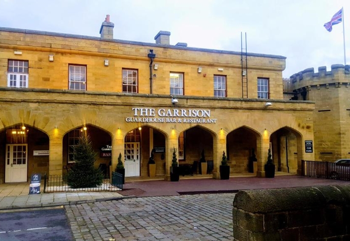 Front exterior of the Garrison Hotel with main entrance