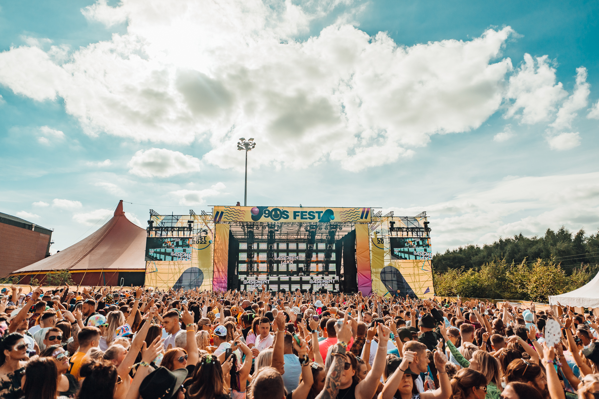 festival crowd with hands in the air