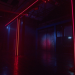 The interior of FØRGE with red neon lights glowing in the darkness.