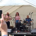 A band performs on a stage in a tent at a previous years Walkley Festival.