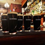 The bar at Fagan's with 5 pints of Gunniess.