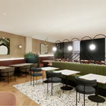 Bar area at DoubleTree by Hilton featuring modern tables and chairs, ambient lighting, and a stylish, contemporary design.