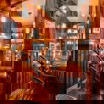 Wood panelled stairs heading down into Capone's Speakeasy.