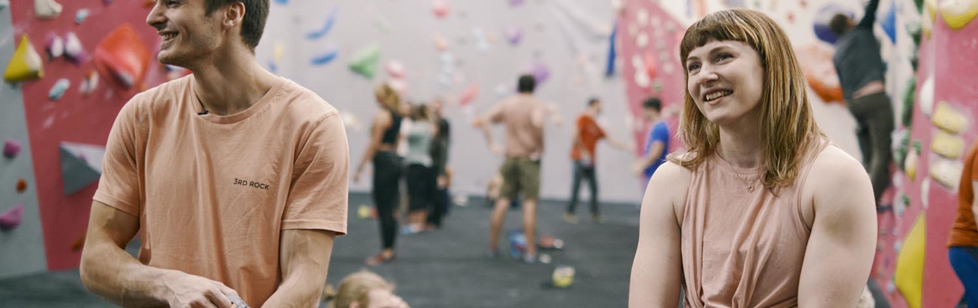 Two people getting ready to climb at The Climbing Hangar.