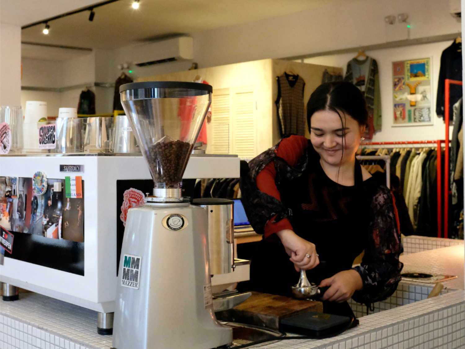 A woman making coffee.