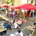 People eating on the terrace at Leopold Square.