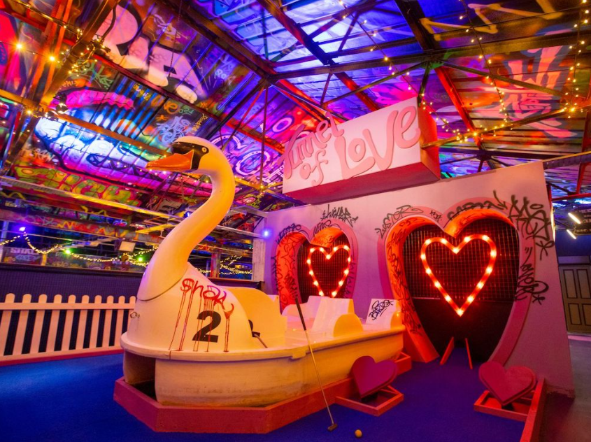 Inside Golf Fang at Sheffield. The décor is bright and cheerful and feels like a fairground.