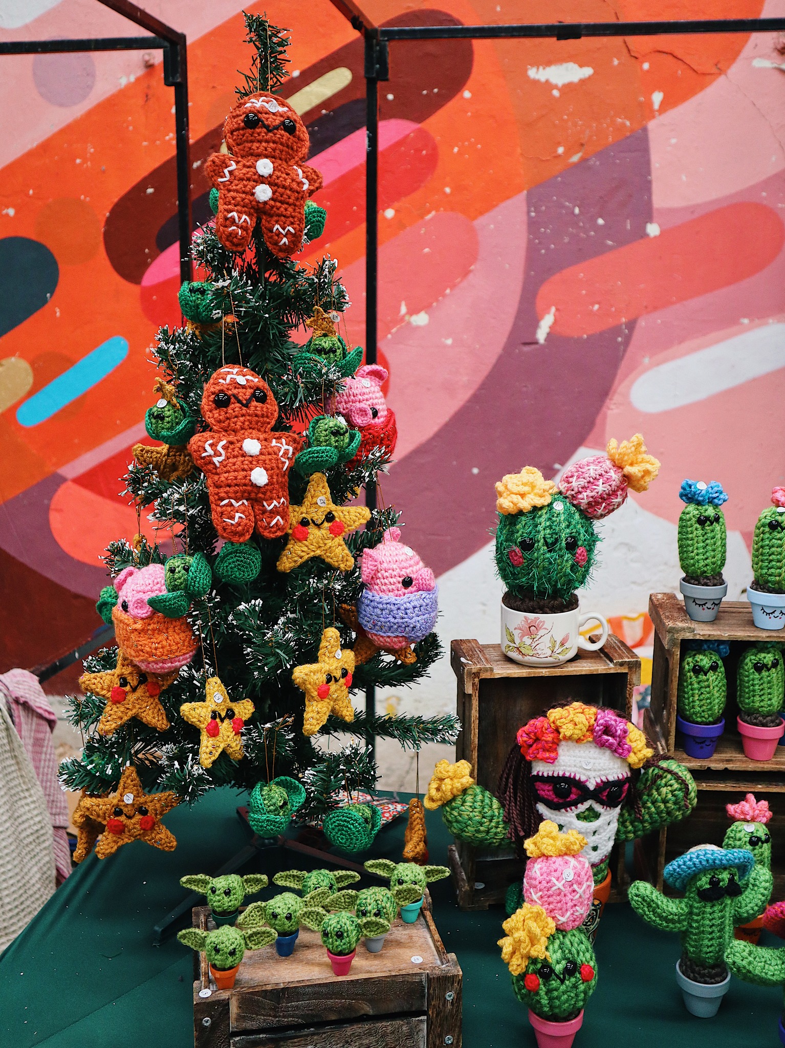 A stall selling crocheted Christmas decorations and cacti.