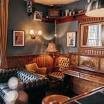 The interior of The Washington, with lots of seating and leather sofas.