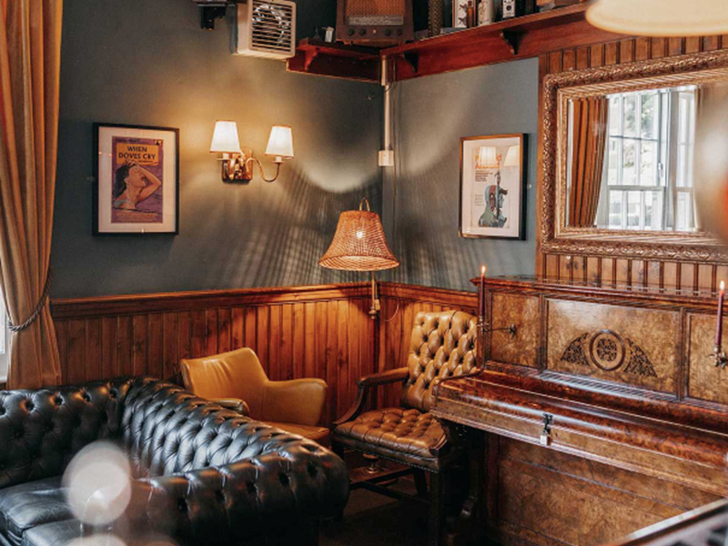 The interior of The Washington, with lots of seating and leather sofas.