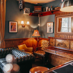 The interior of The Washington, with lots of seating and leather sofas.