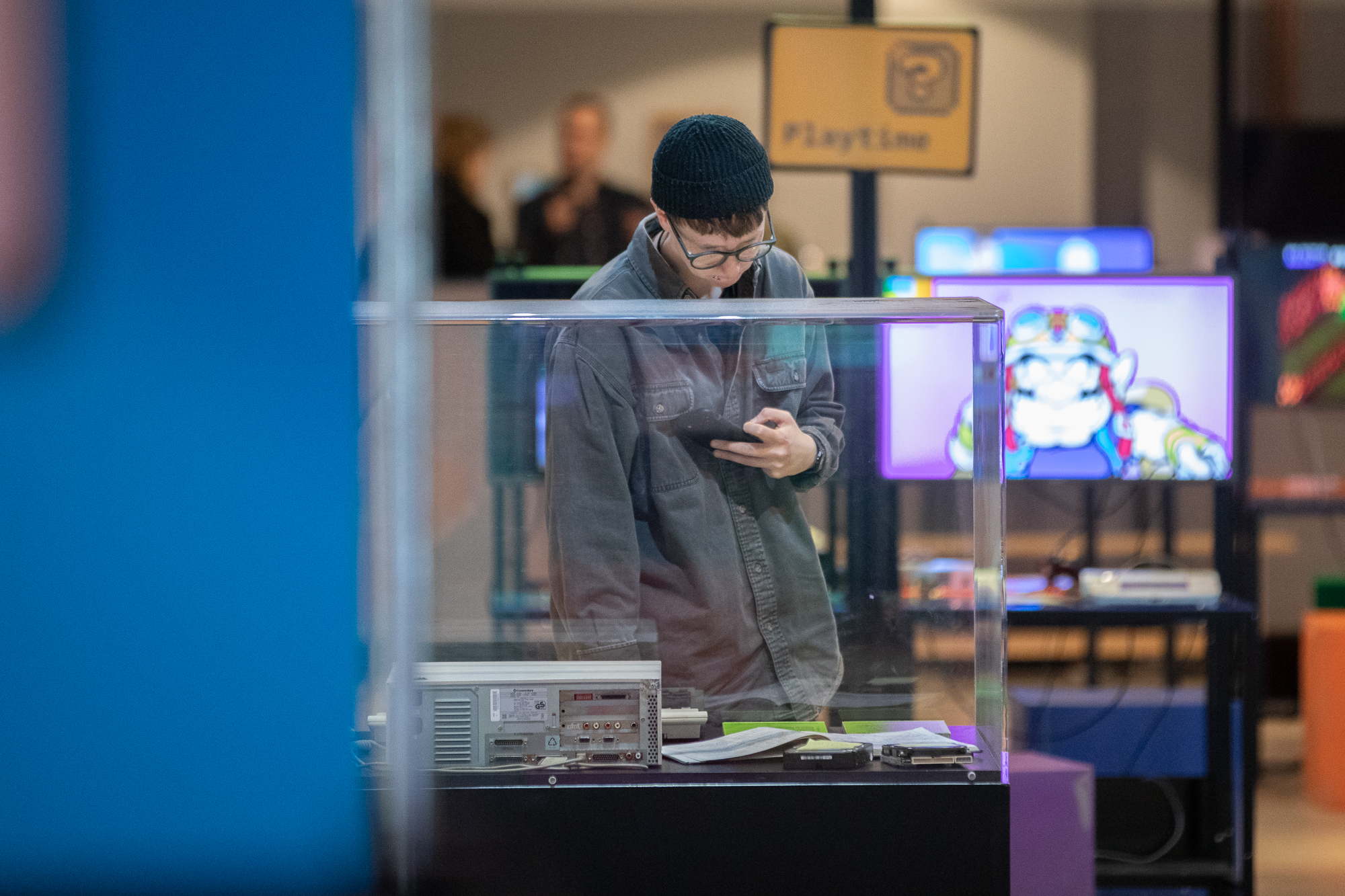 A person looking at an exhibition at The National Videogame Museum.