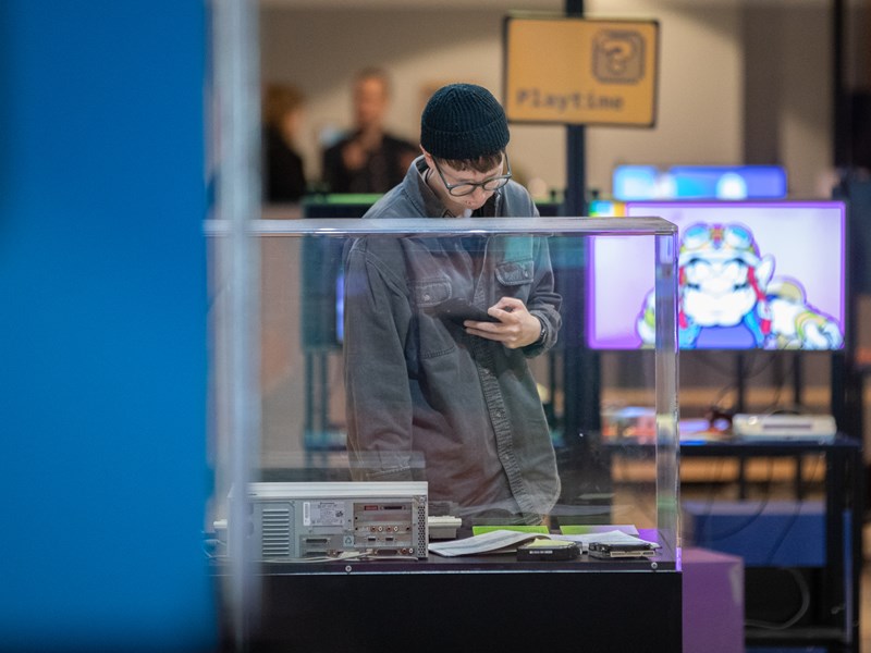 A person looking at an exhibition at The National Videogame Museum.