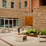 Outdoor area with benches and planted garden.