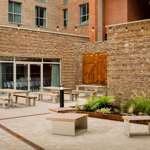 Outdoor area with benches and planted garden.