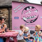 A family enjoying an ice cream at Our Cow Molly Farm.