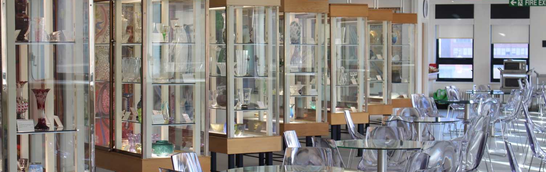 Rows of display cabinets at the Turner Museum Of Glass.