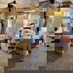 A hotel room with a four poster bed.