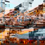 The courtyard at Hagglers Corner, filled with tables and chairs. You can also see the balcony that runs around the second floor.