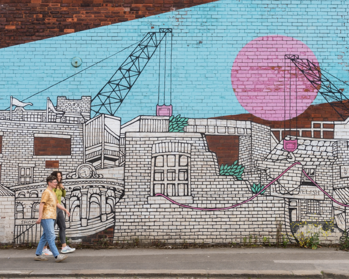 An intricated mural of a city scape filled with character and detail.