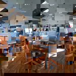 Café area at Waleswood Caravan and Camping Park with tables, chairs, and a welcoming atmosphere.